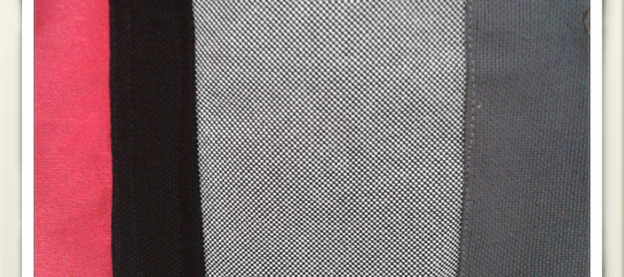 Loneta grisa eta beltza, tira eta oihal gorriarekin.